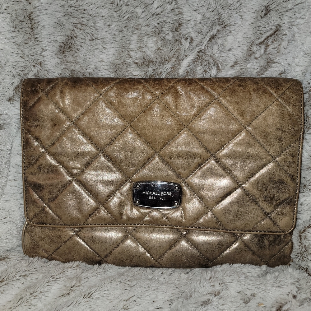 Michael Kors gold clutch/shoulder bag.
